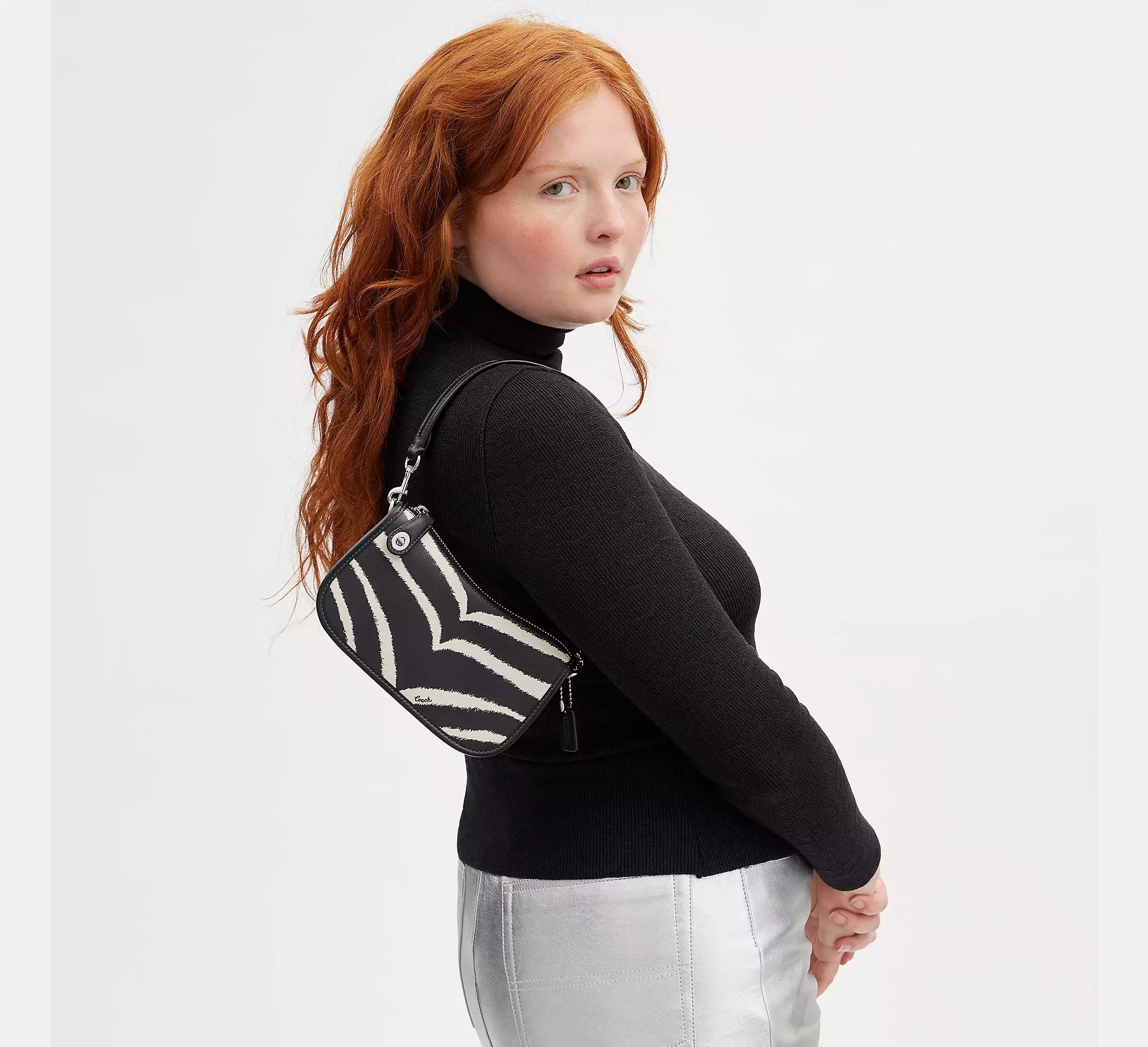 model wearing the black and white striped version