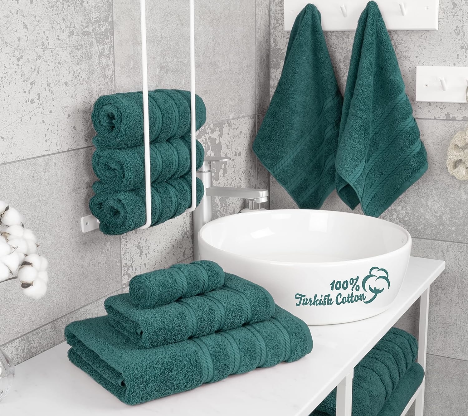 green towels arranged in a bathroom