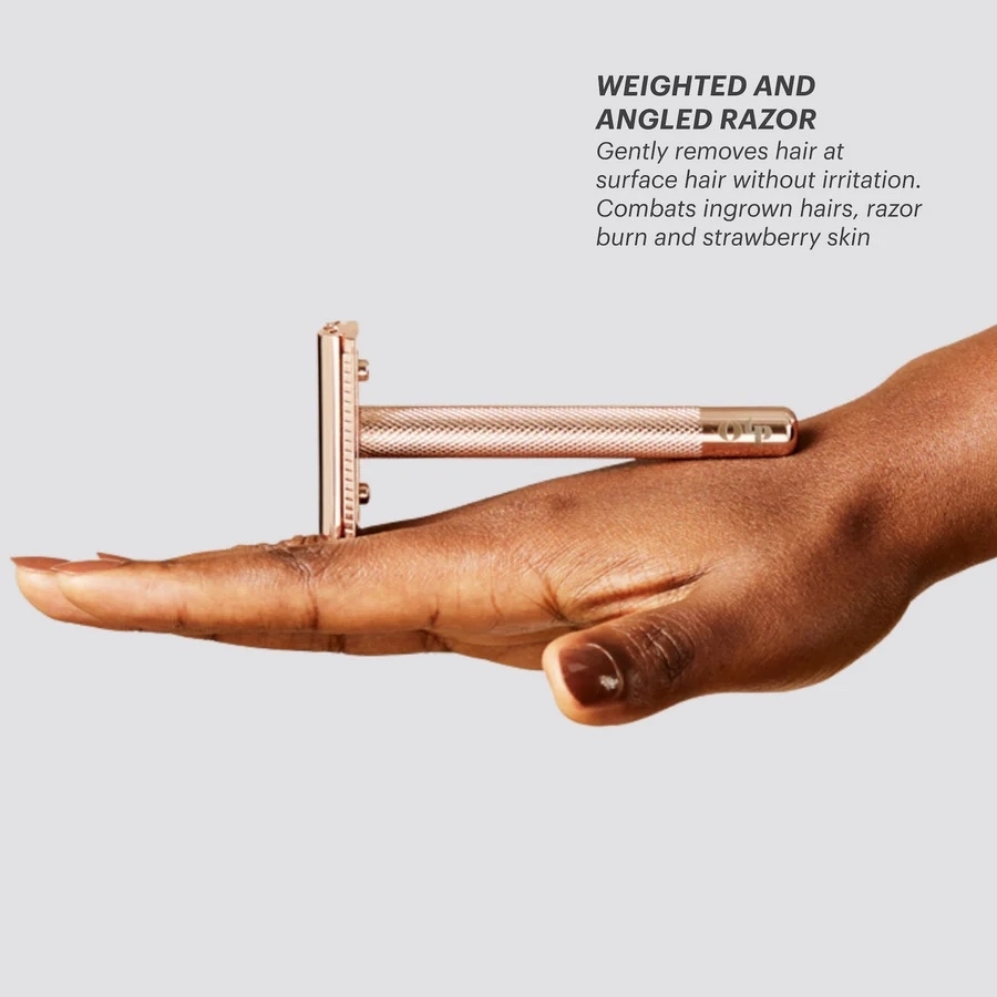 a model balancing the razor on their hand
