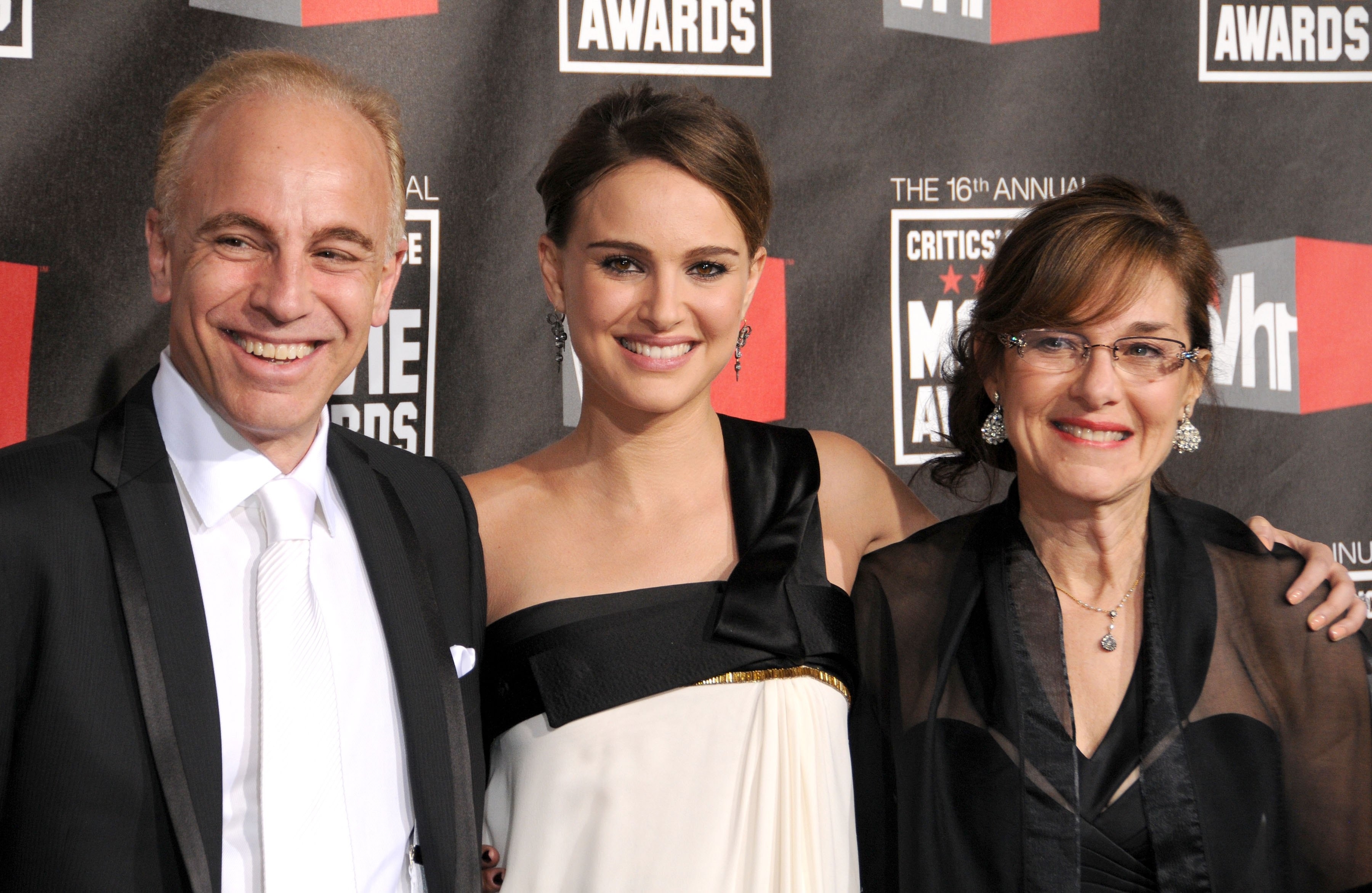 closeup of her and her parents at an awards event