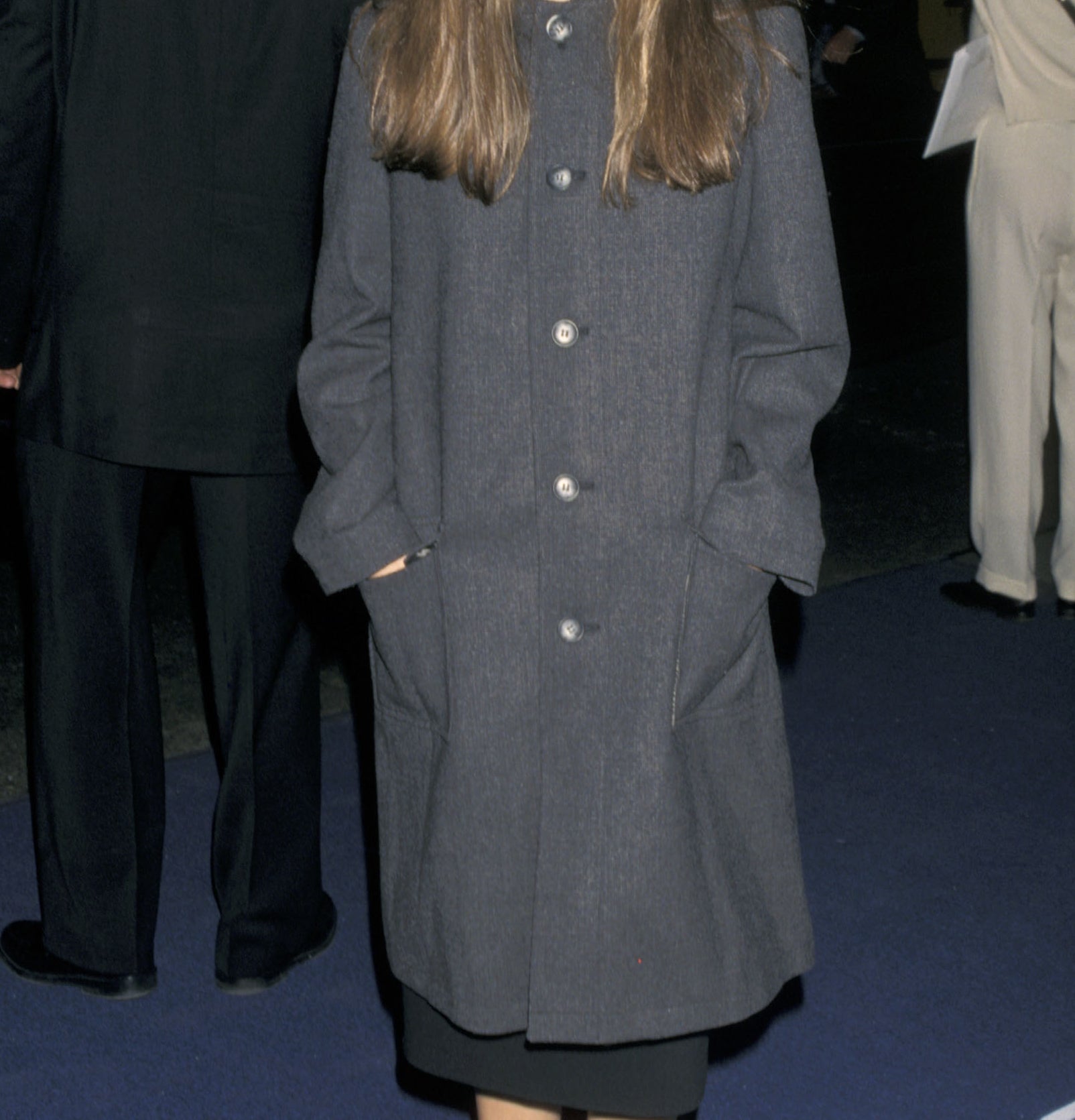 young natalie in an oversized jacket at an event