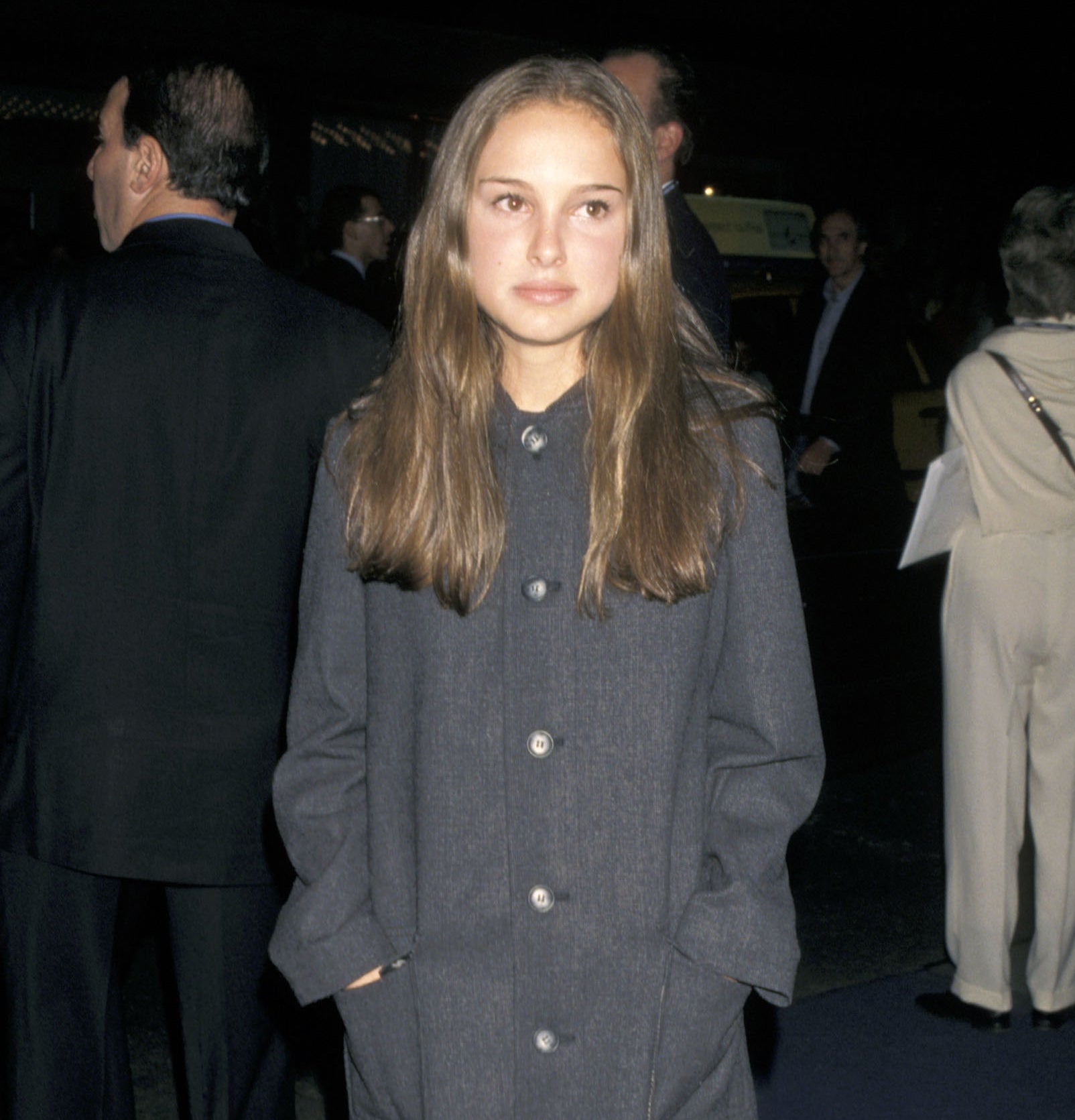 young natalie in an oversized jacket at an event