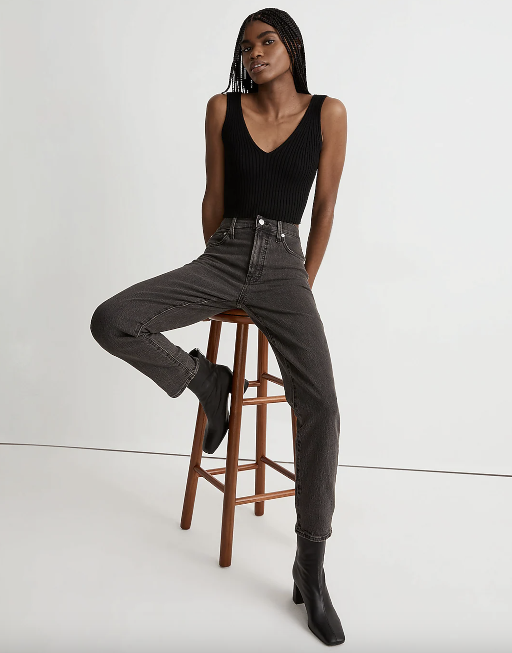 model wearing high rise jeans in black
