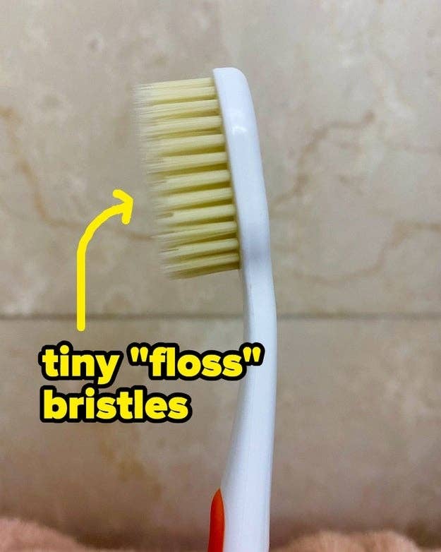A toothbrush with two layers of bristles, one long and thin and one shorter and thicker