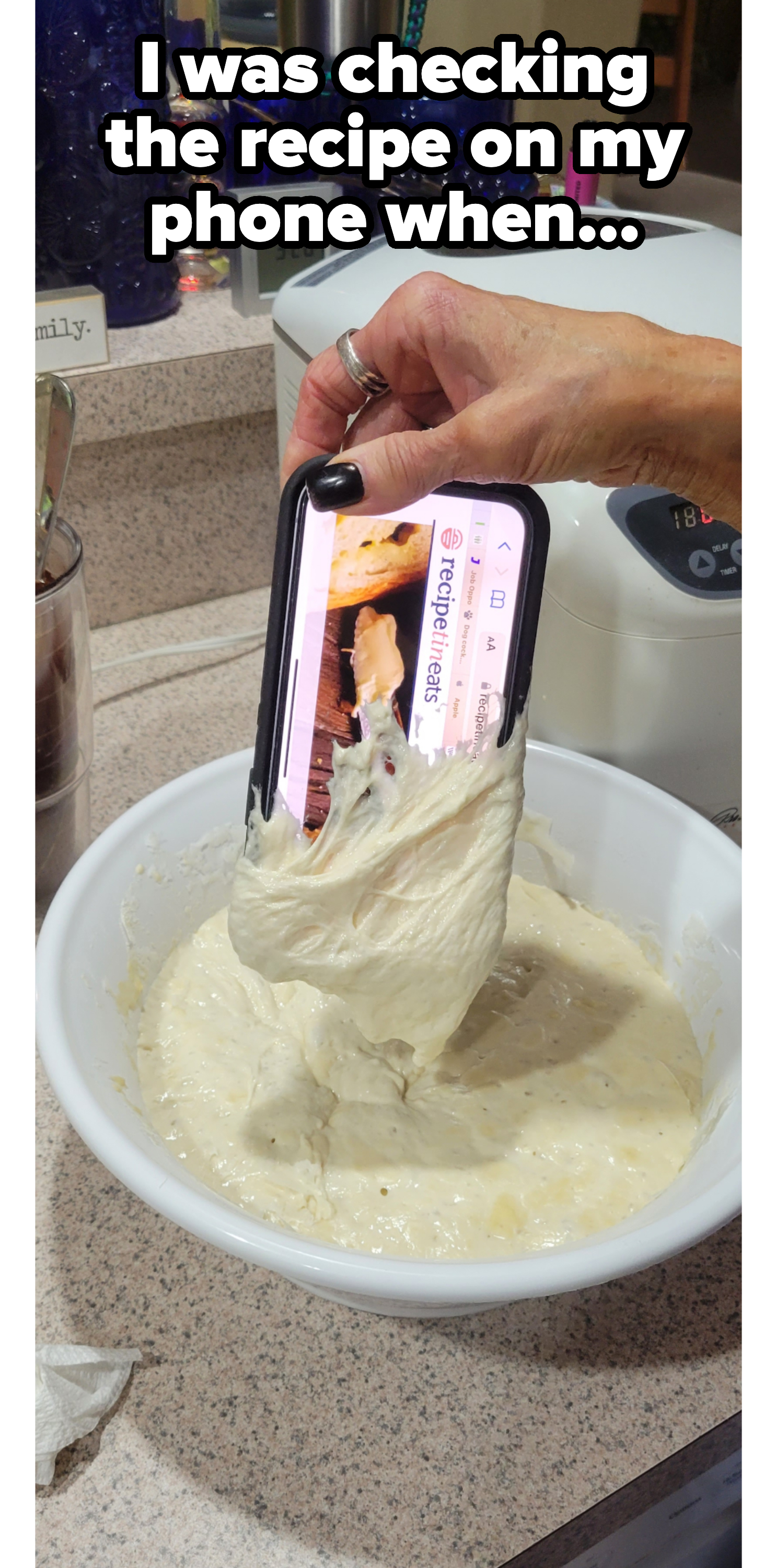 a person taking their phone out of some cream