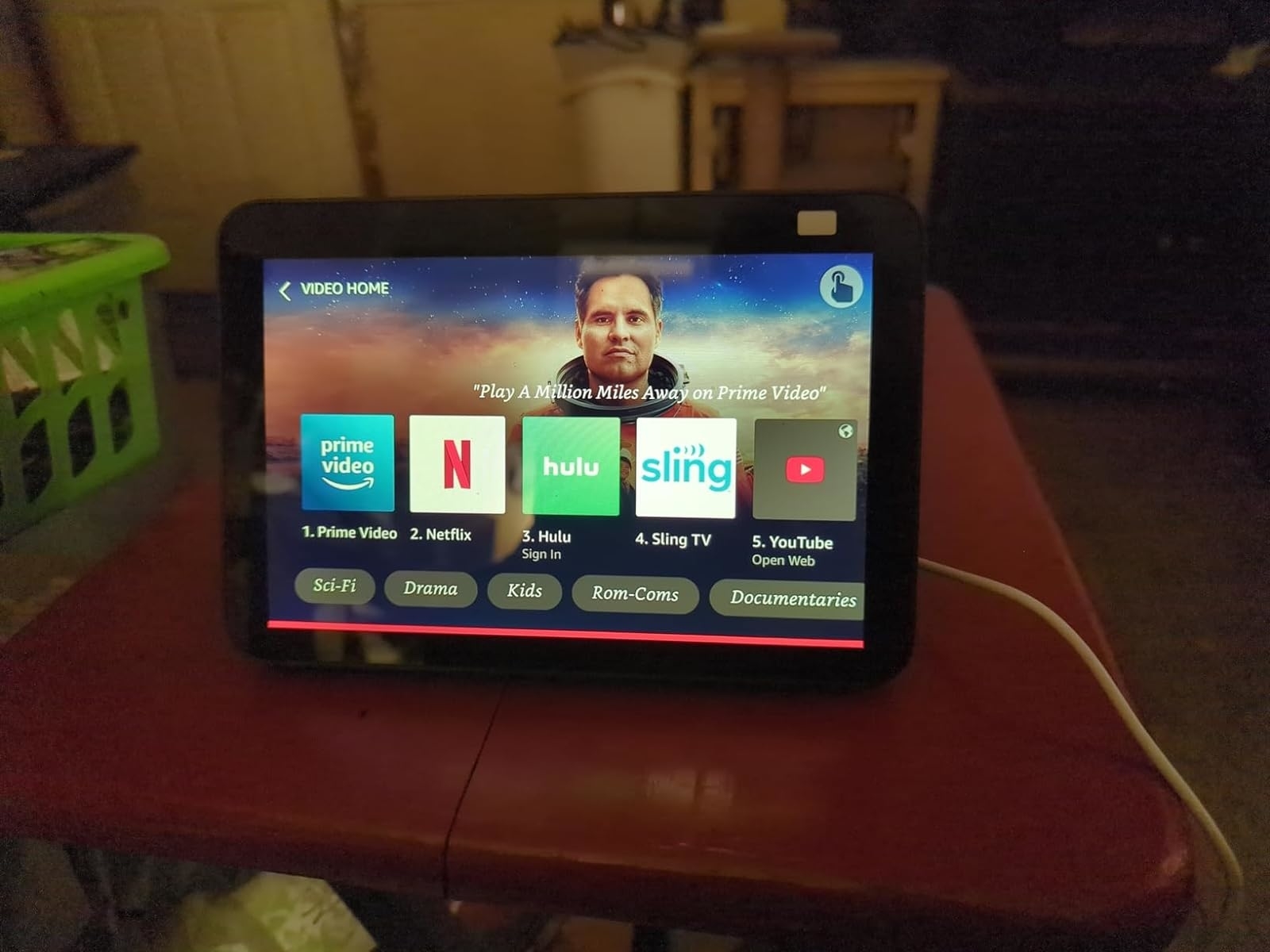 a reviewer&#x27;s echo show on the table showing the streaming services on it