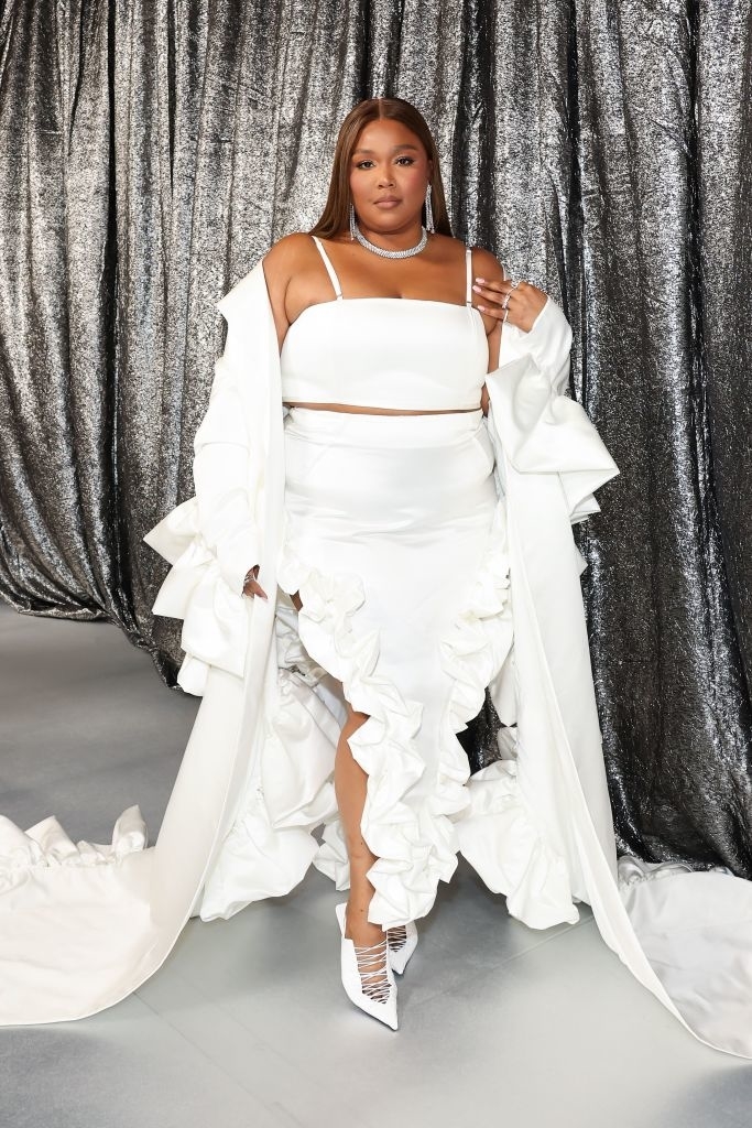 Lizzo in a frilly-bottom, spaghetti-strap gown