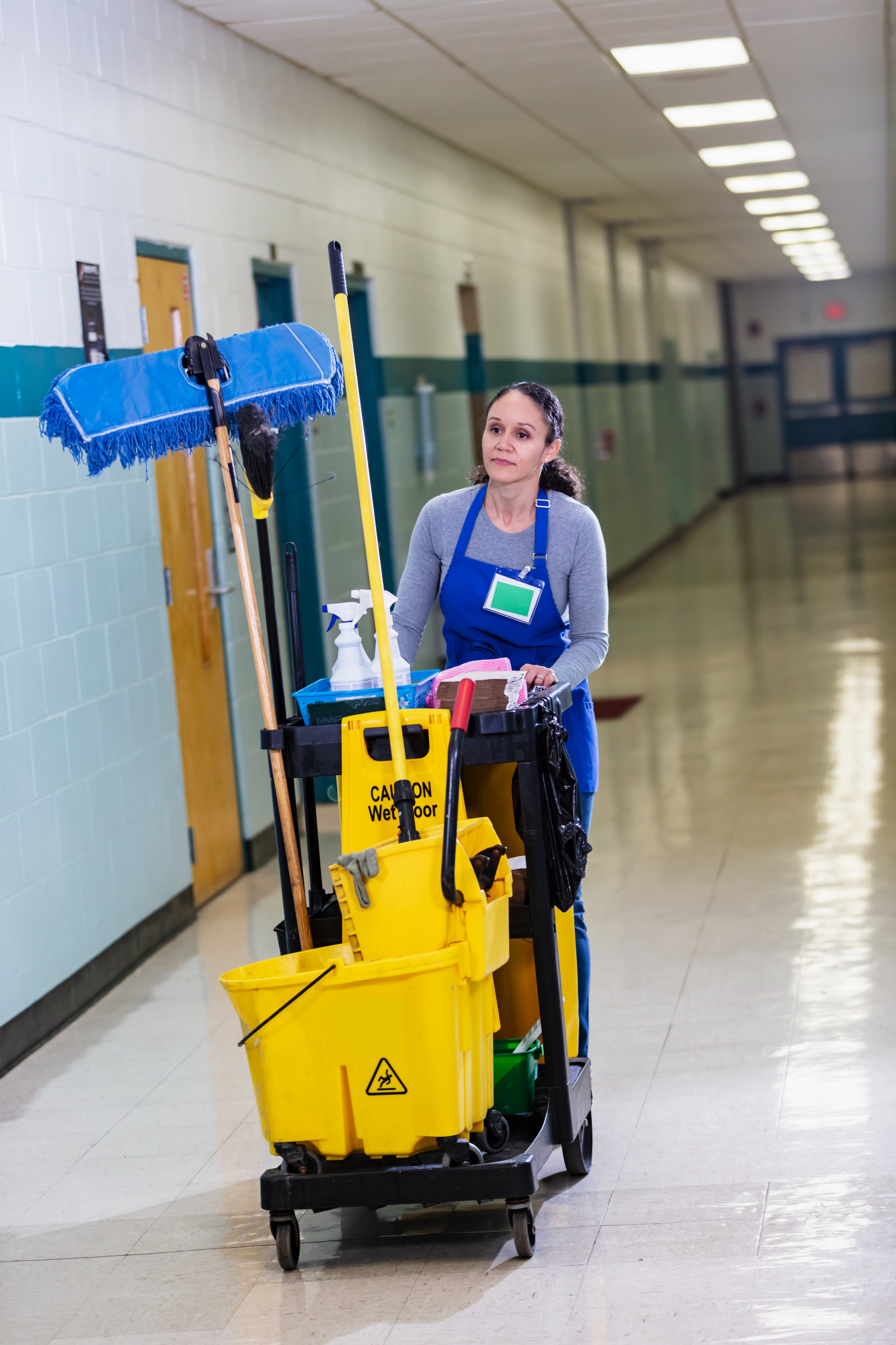 A janitor walking down a hall