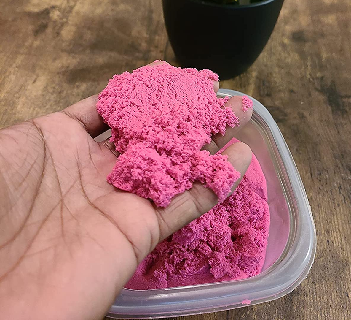 A reviewer&#x27;s pink kinetic sand