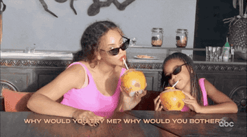 Beyoncé and Blue Ivy drinking from tropical bowls through straws