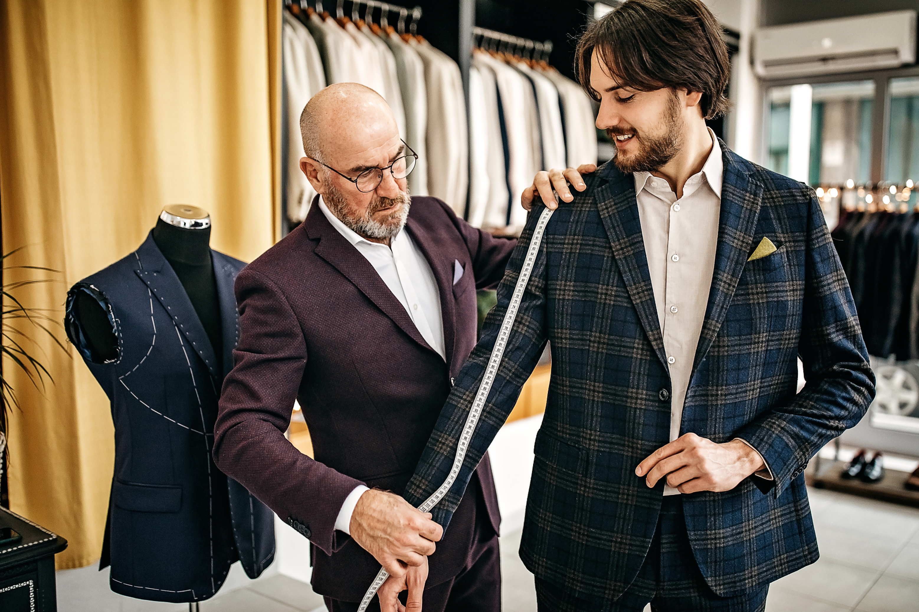 A man getting fitted for a suit
