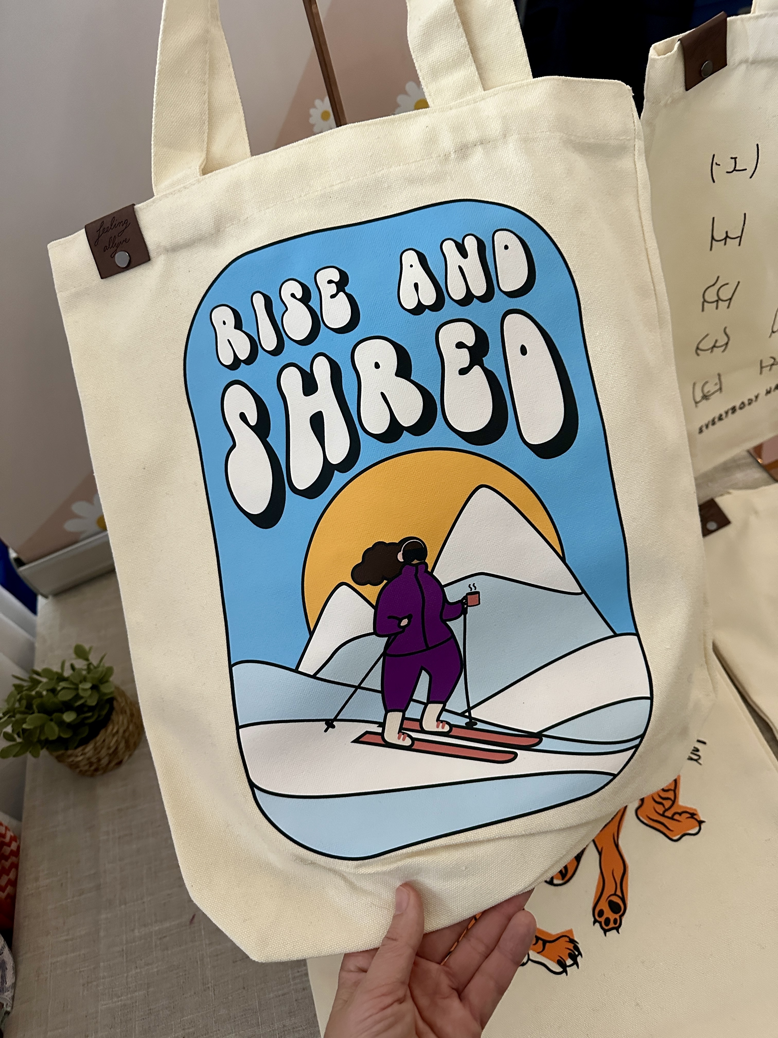 A tote bag that says &quot;Rise &amp;amp; Shred&quot;