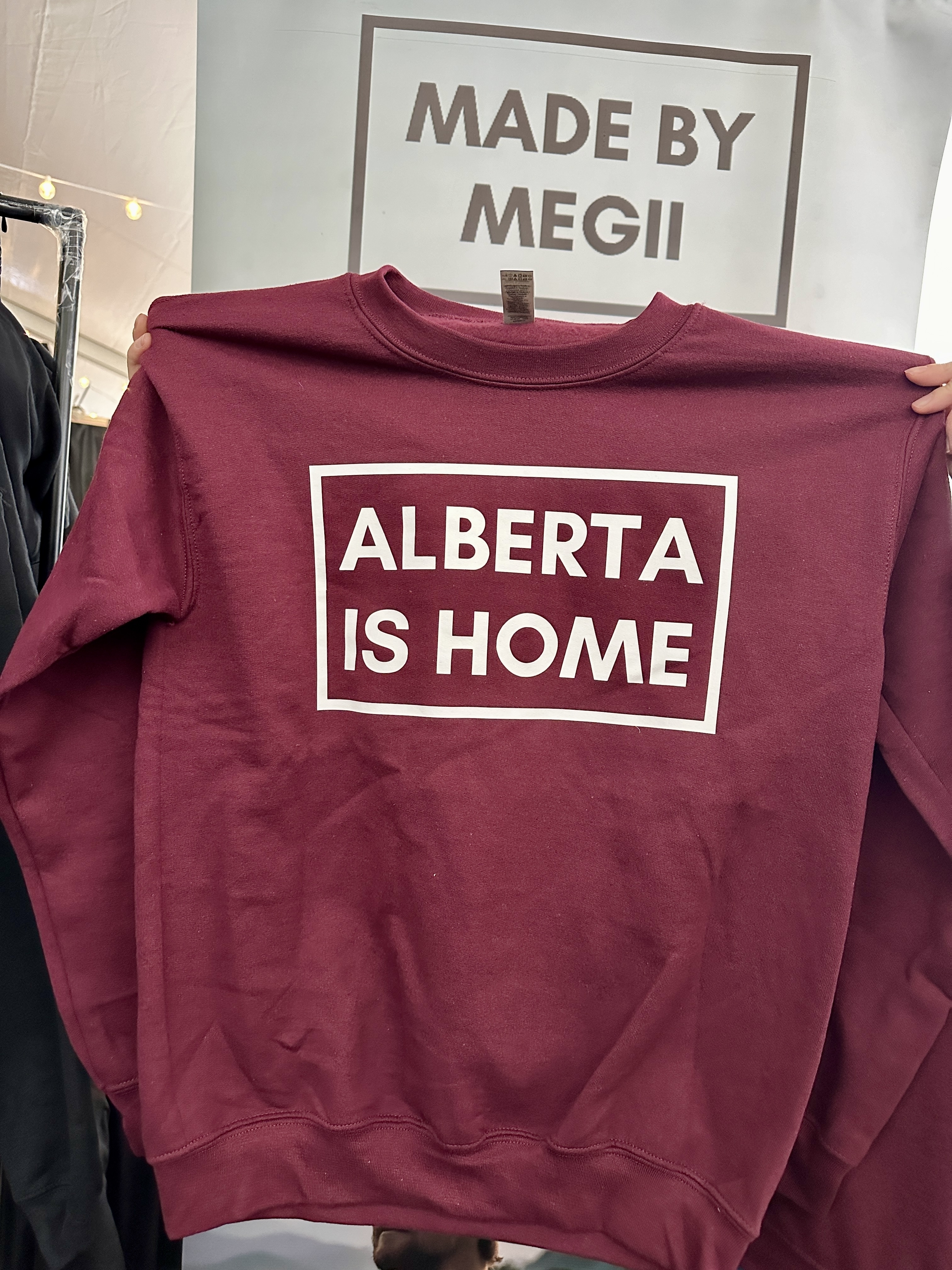 A maroon Alberta is home sweater