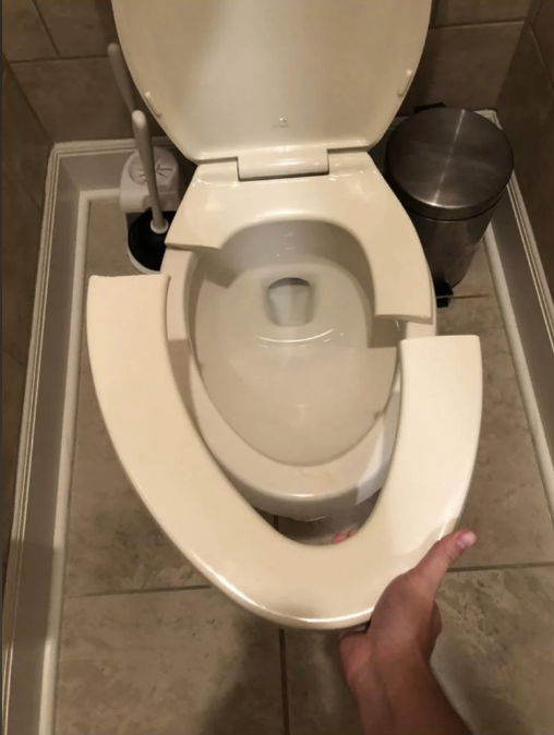 a broken toilet seat
