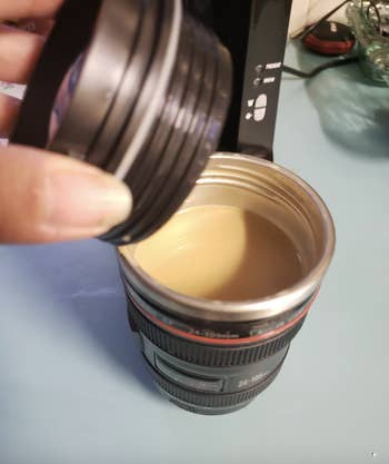 The lid screwed off to show the coffee inside