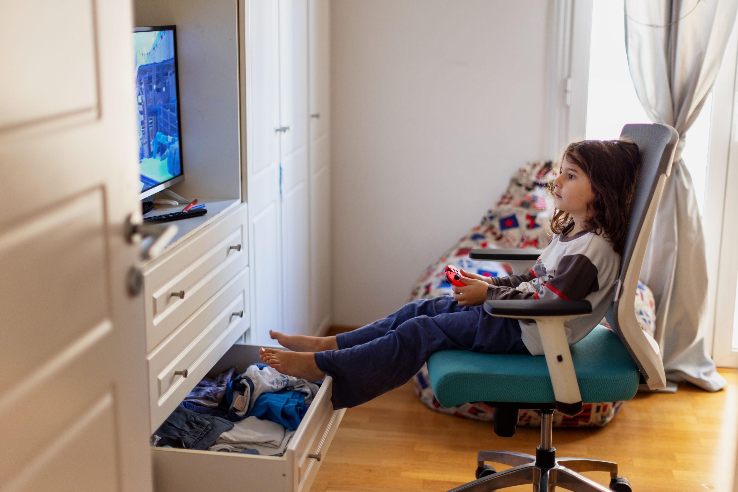 A little girl playing a video game