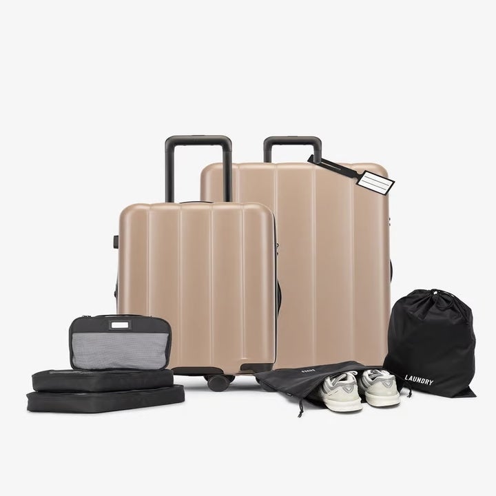 two suitcases and various travel accessories