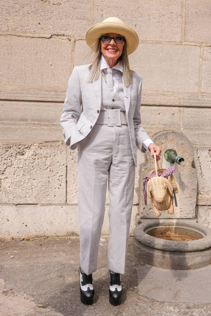 Closeup of Diane Keaton in a pantsuit and hat