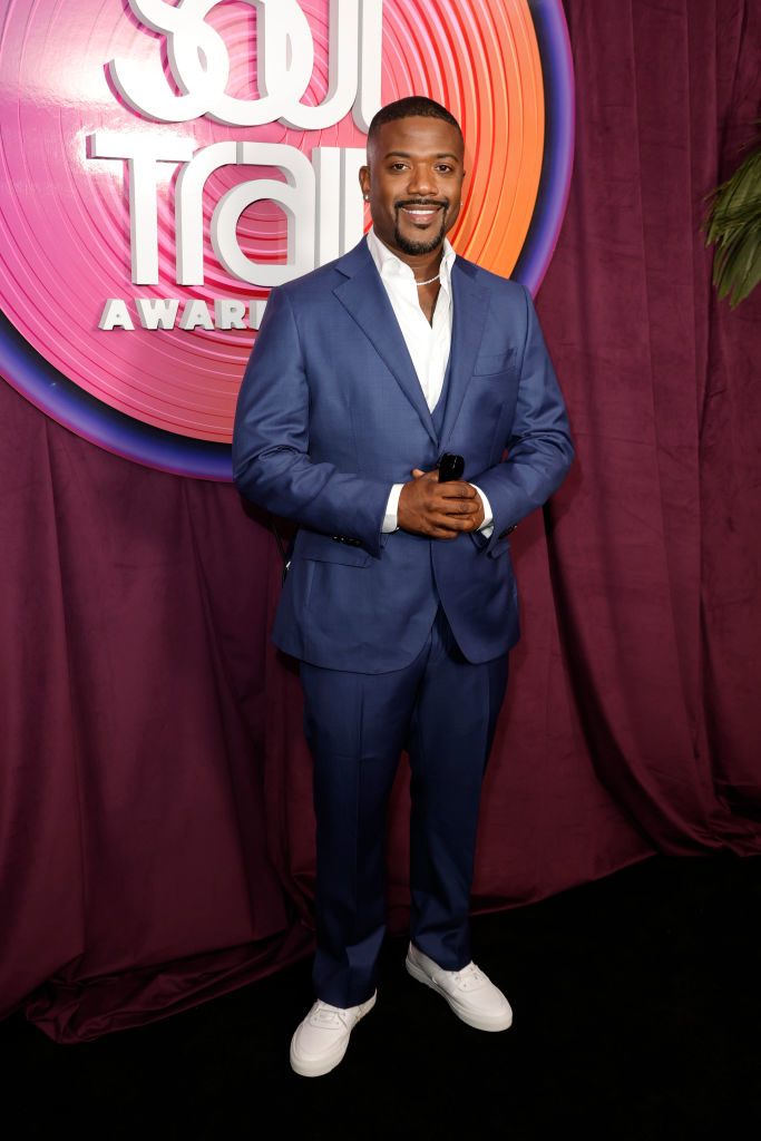 Ray J in a casual suit and sneakers