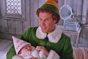 Buddy the Elf holding baby Susie