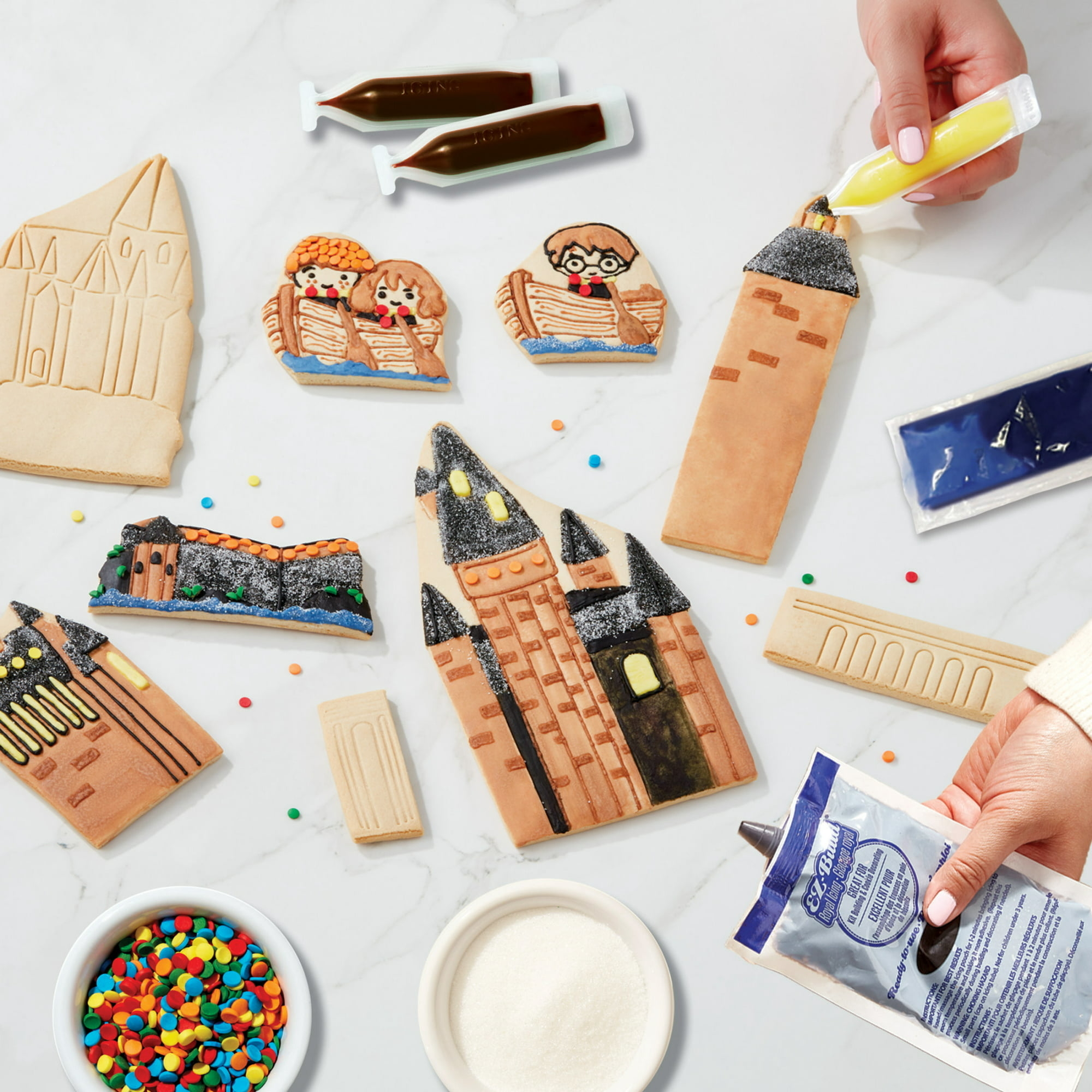 a layout of all the cookies and elements in the harry potter gingerbread kit