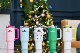 The tumbler in five bright colors, including pink, green, blue, and confetti