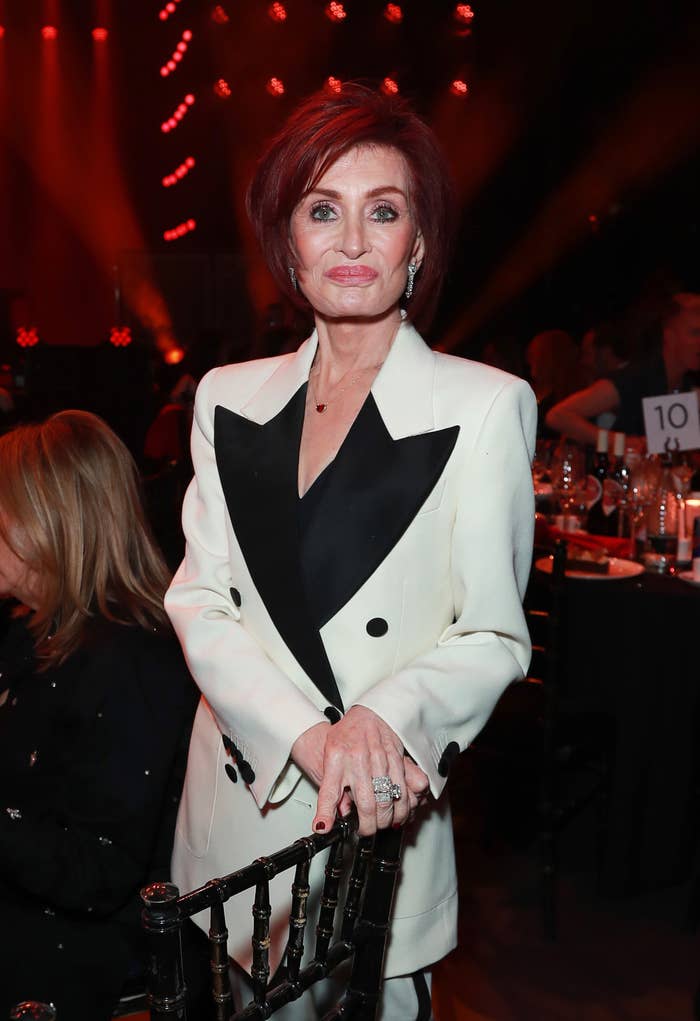 Closeup of Sharon Osbourne in a coat with ovesized lapels