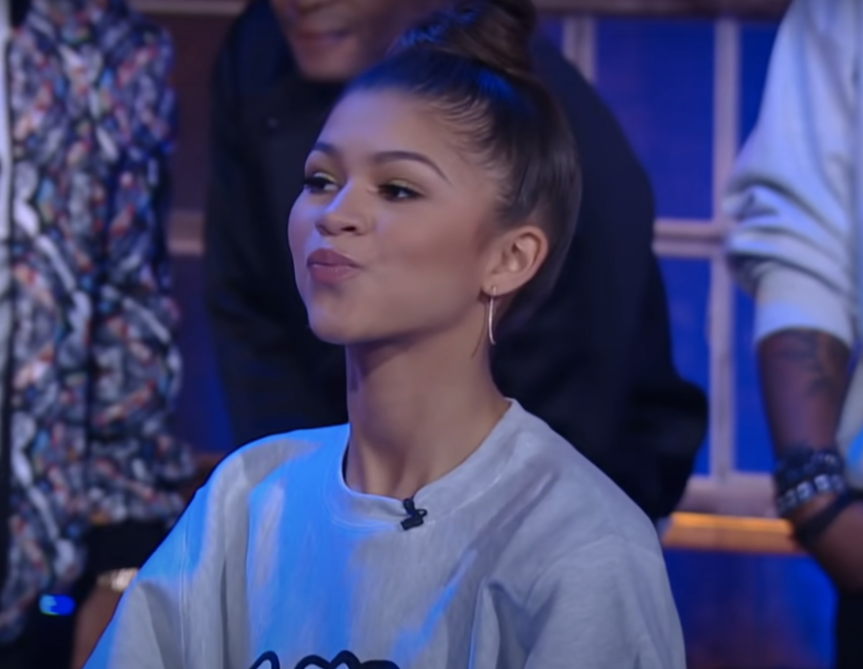 Closeup of Zendaya holding water in her mouth