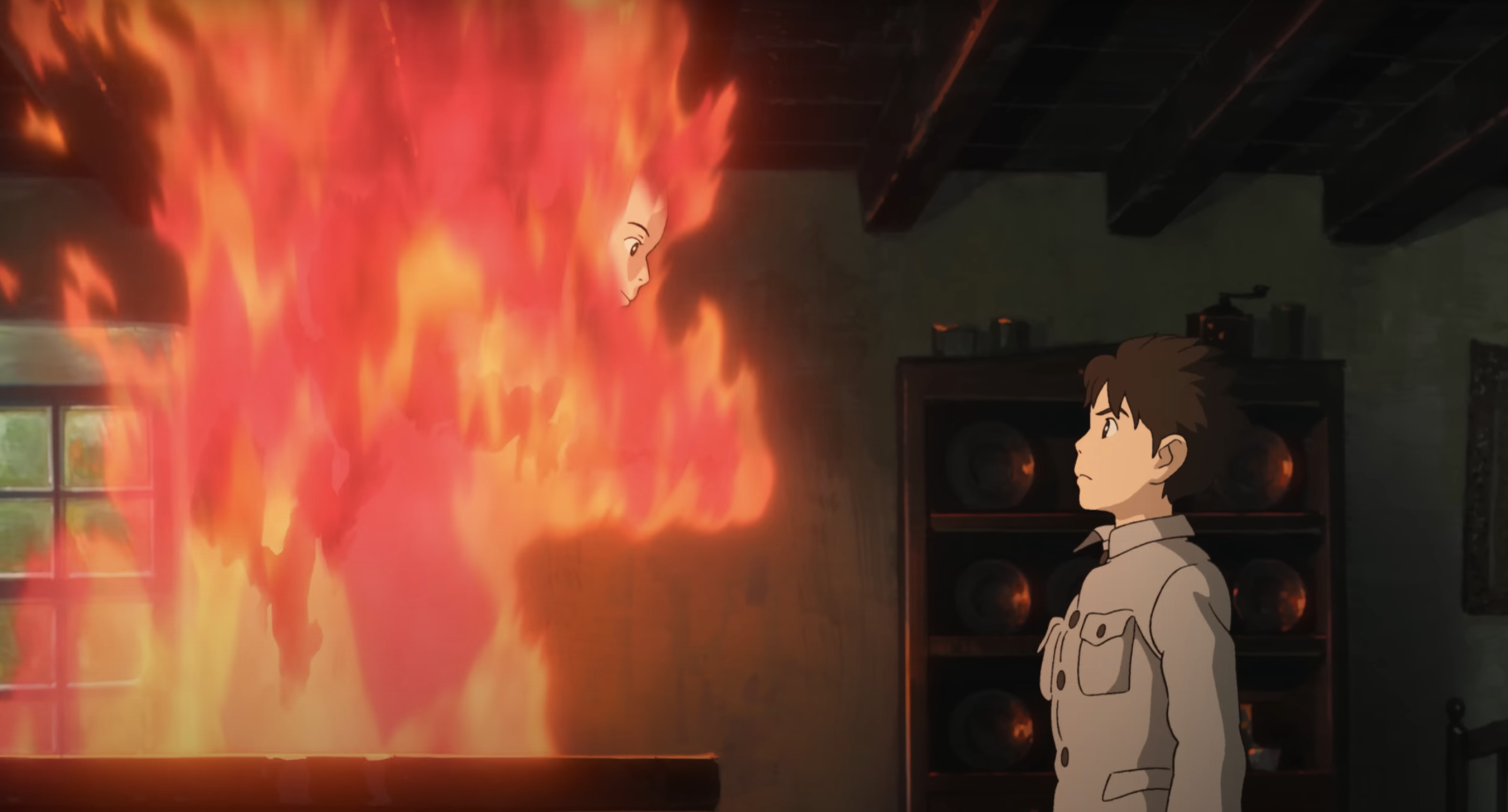 boy in a uniform standing in front of a person made of flames