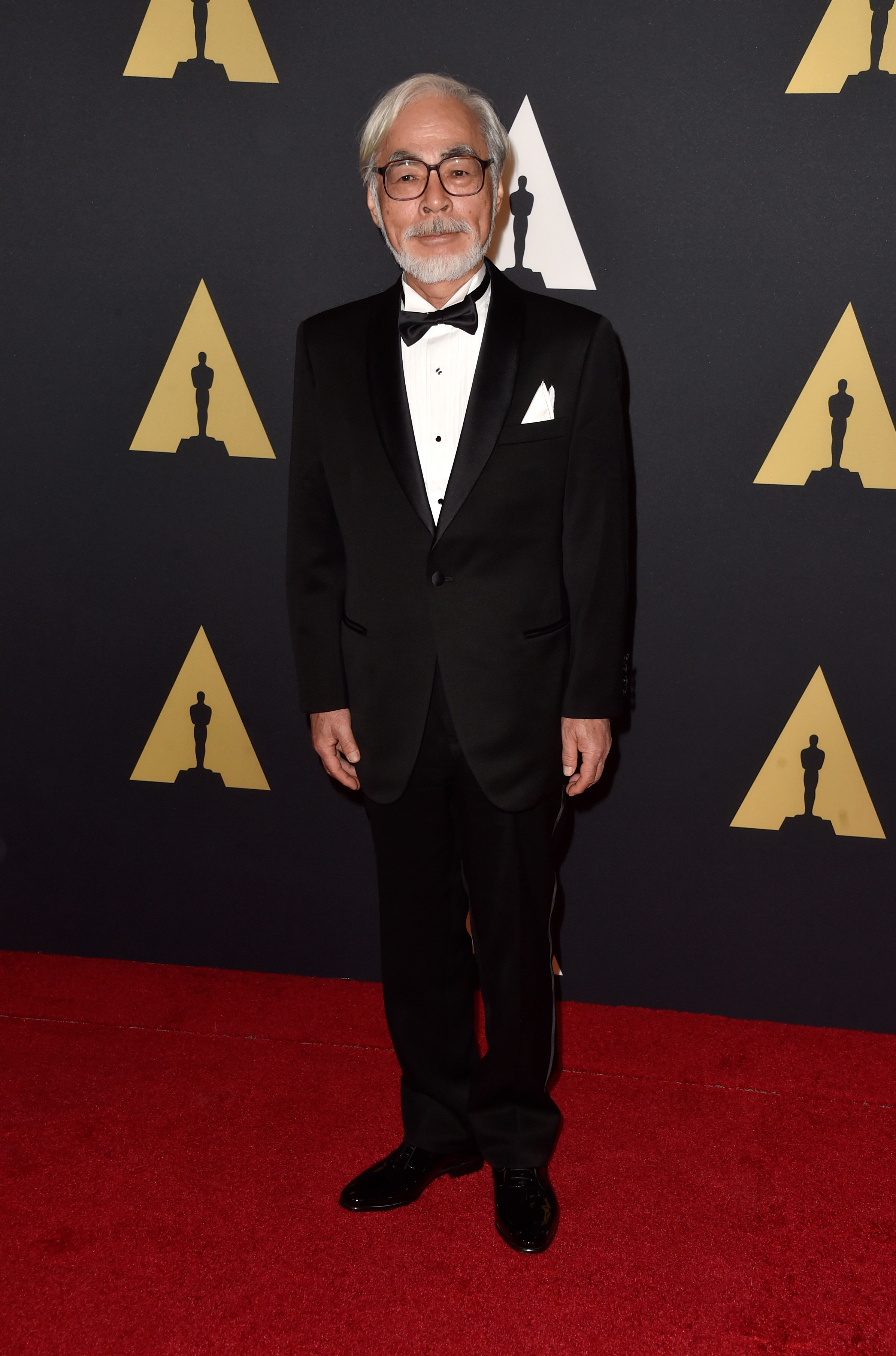miyazaki on the red carpet wearing a suit