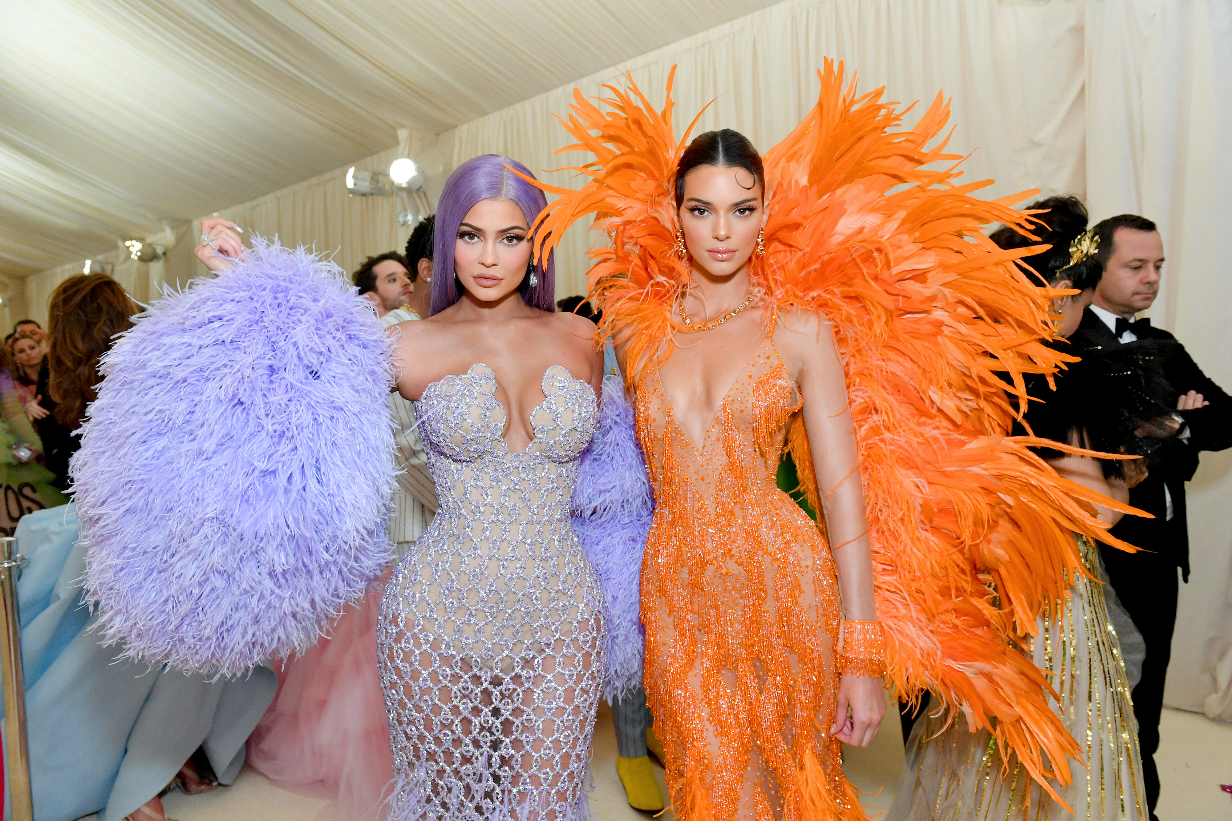 the two at the met gala wearing dresses with feathers