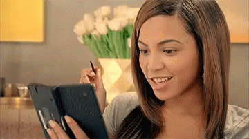 GIF of Beyoncé using a phone