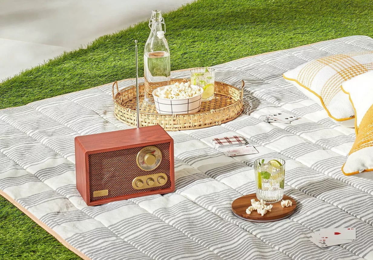 The radio featuring a classic design in a brown hue and brass-tone knobs