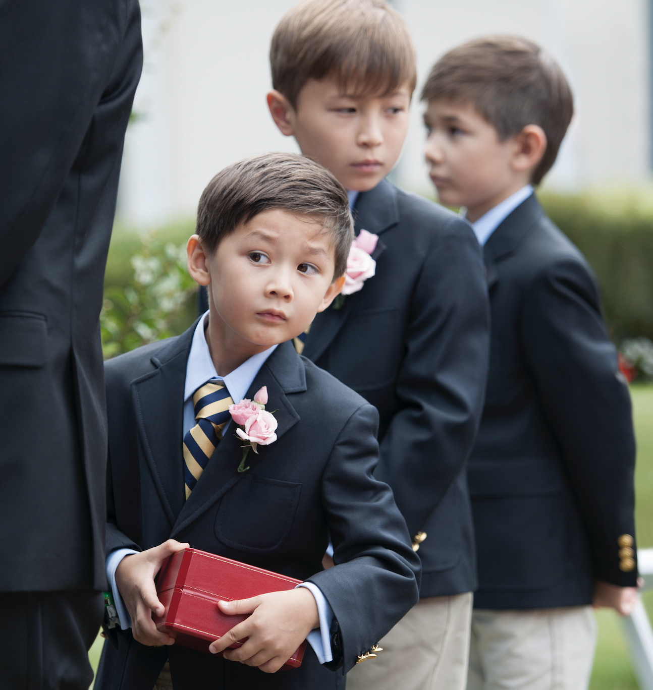 Young boys, including the ring bearer, at a wedding