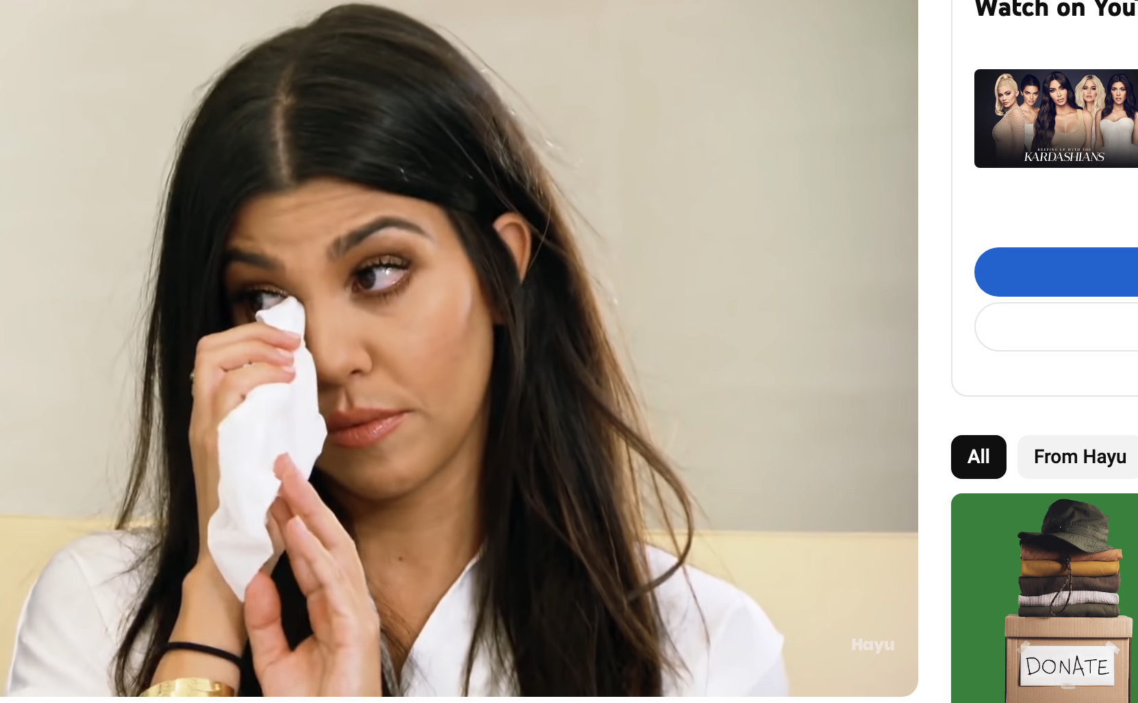Close-up of Kourtney wiping her eye with tissues