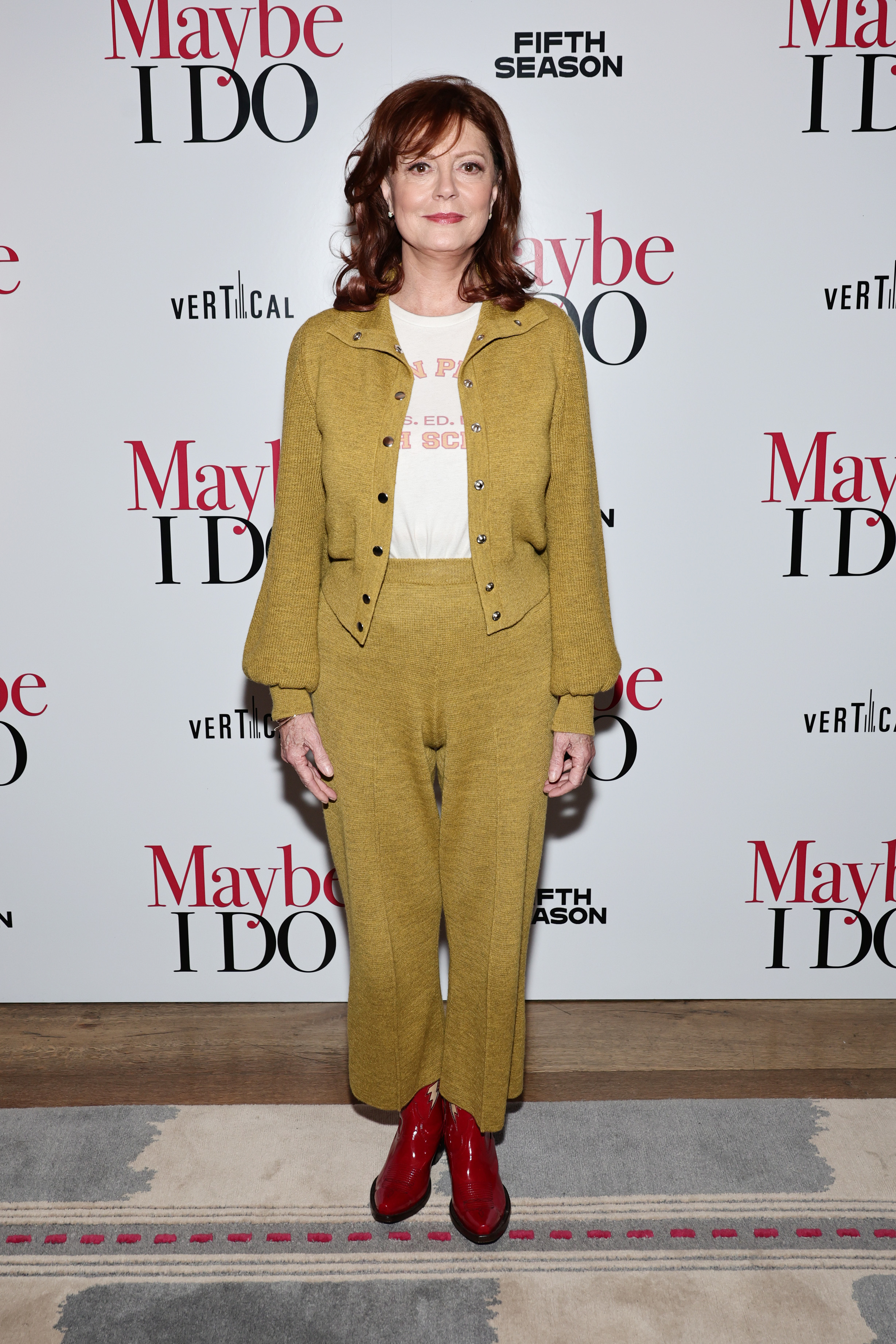 Susan in a pantsuit at a media event