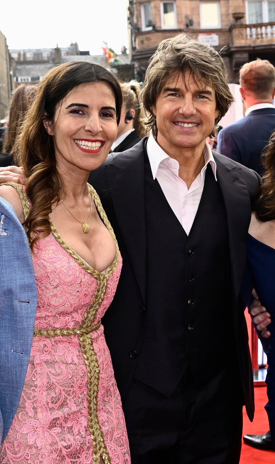 Close-up of Maha and Tom smiling on the red carpet
