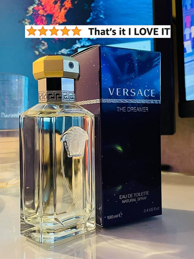 reviewers bottle of Versace cologne next to the box