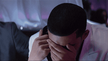Drake holds his mouth and cries.