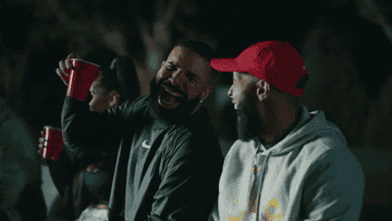 Drake and Odell Beckham Jr. laugh.