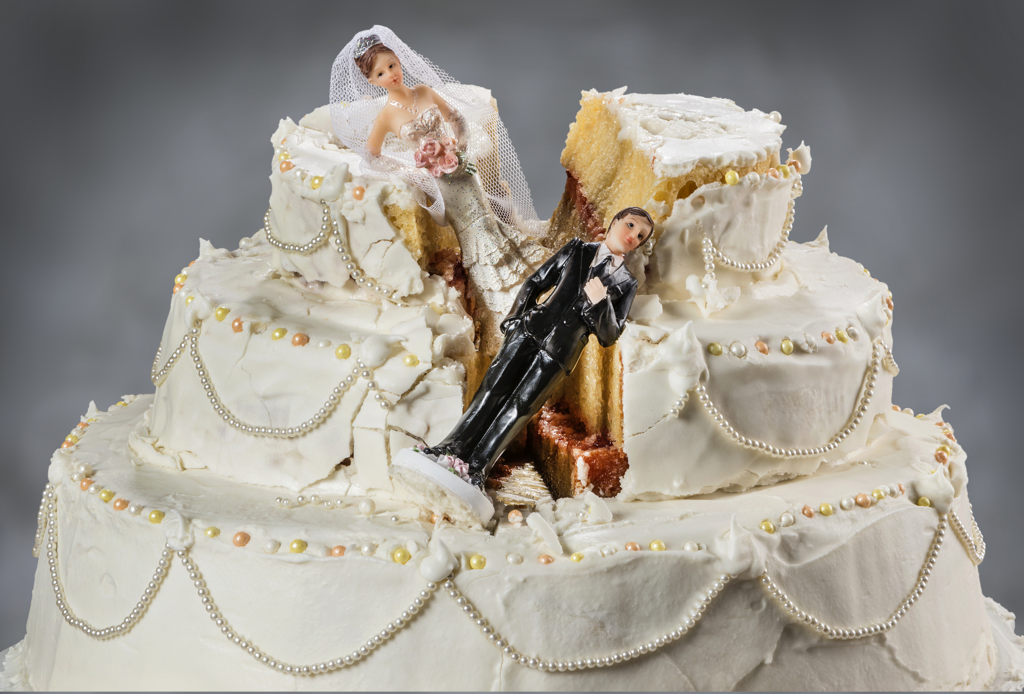 destroyed wedding piece with the wedding toppers