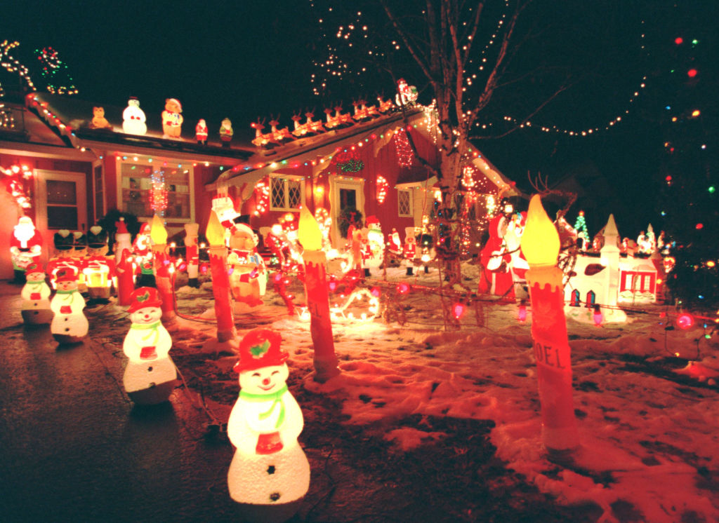 an entire front yard covered with lit-up christmas decor