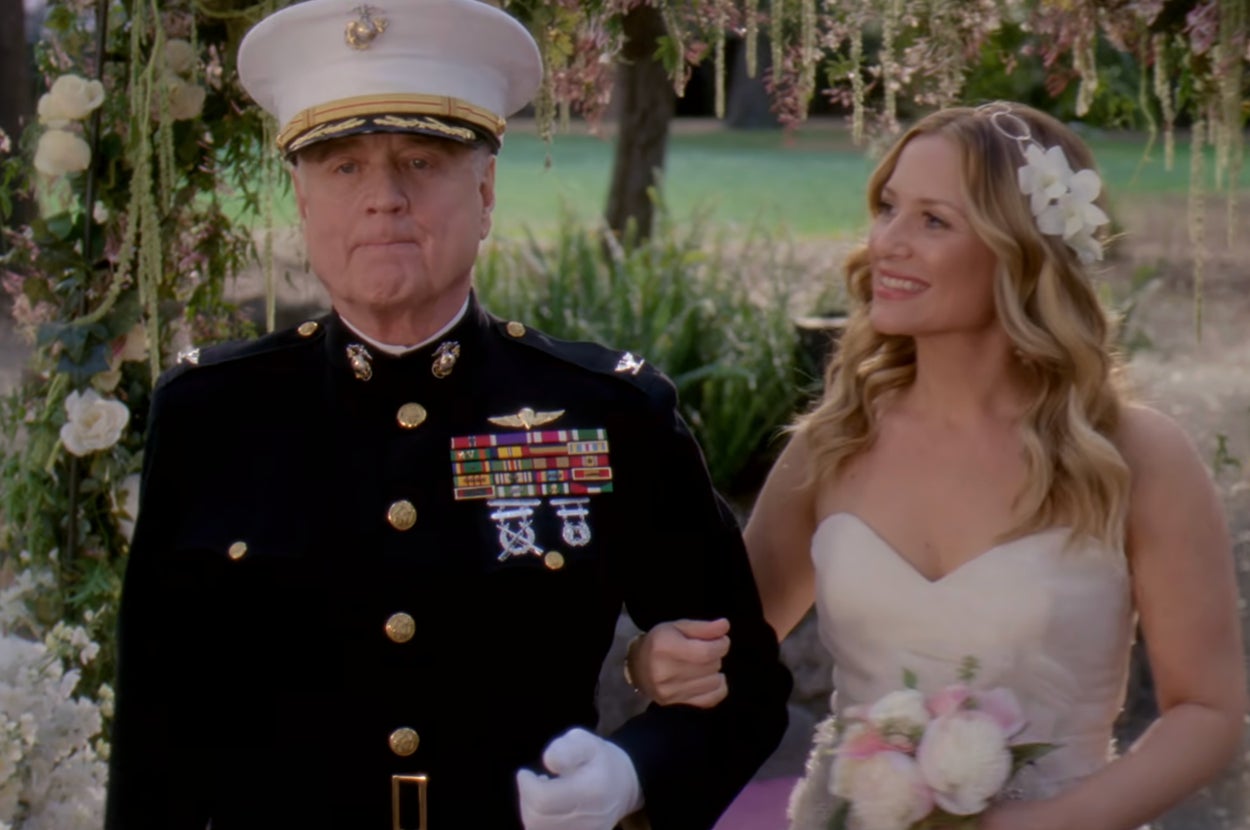 father walking his daughter down the aisle at her wedding