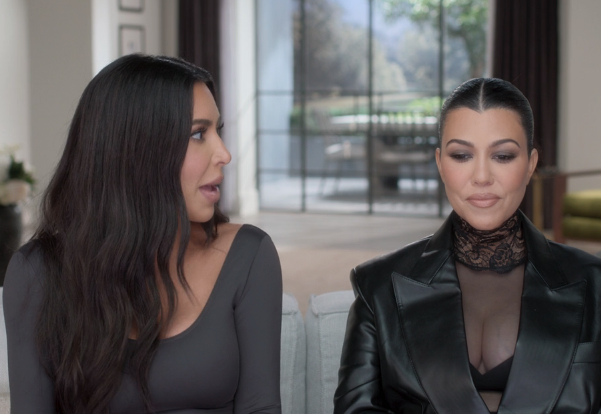 Close-up of Kim and Kourtney sitting together