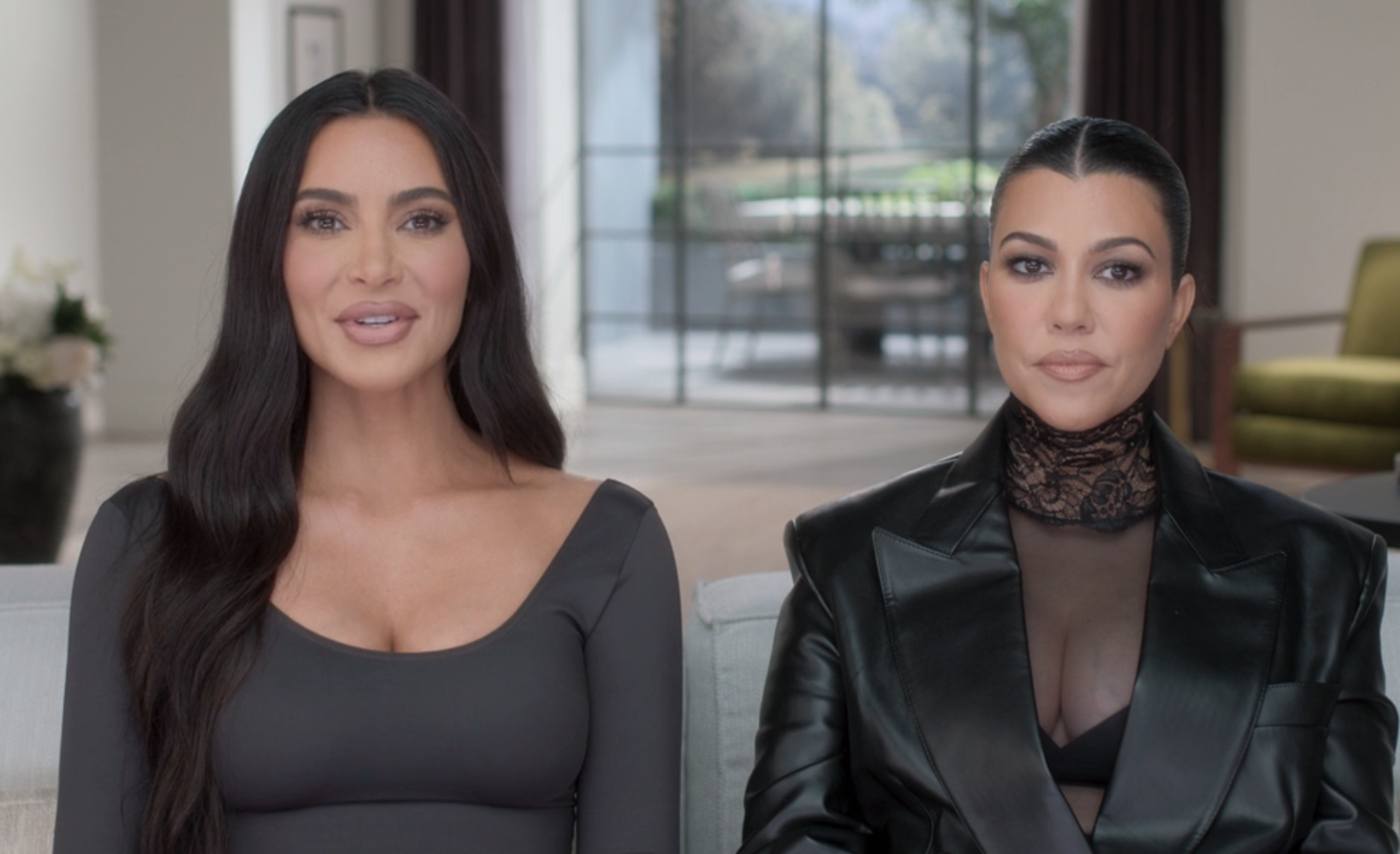 Close-up of Kim and Kourtney sitting together