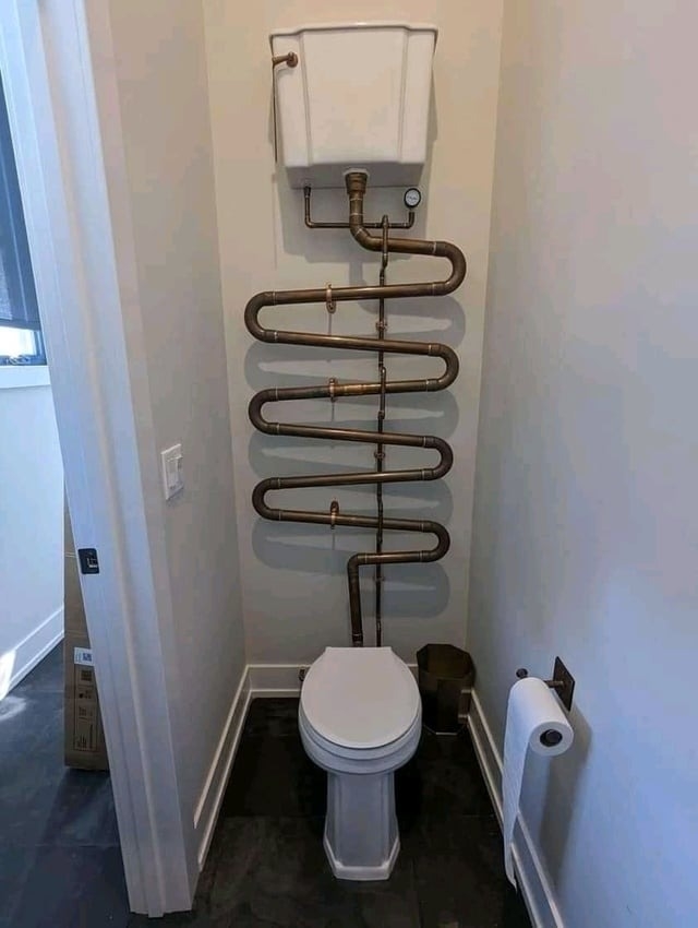 A large pipe over a toilet