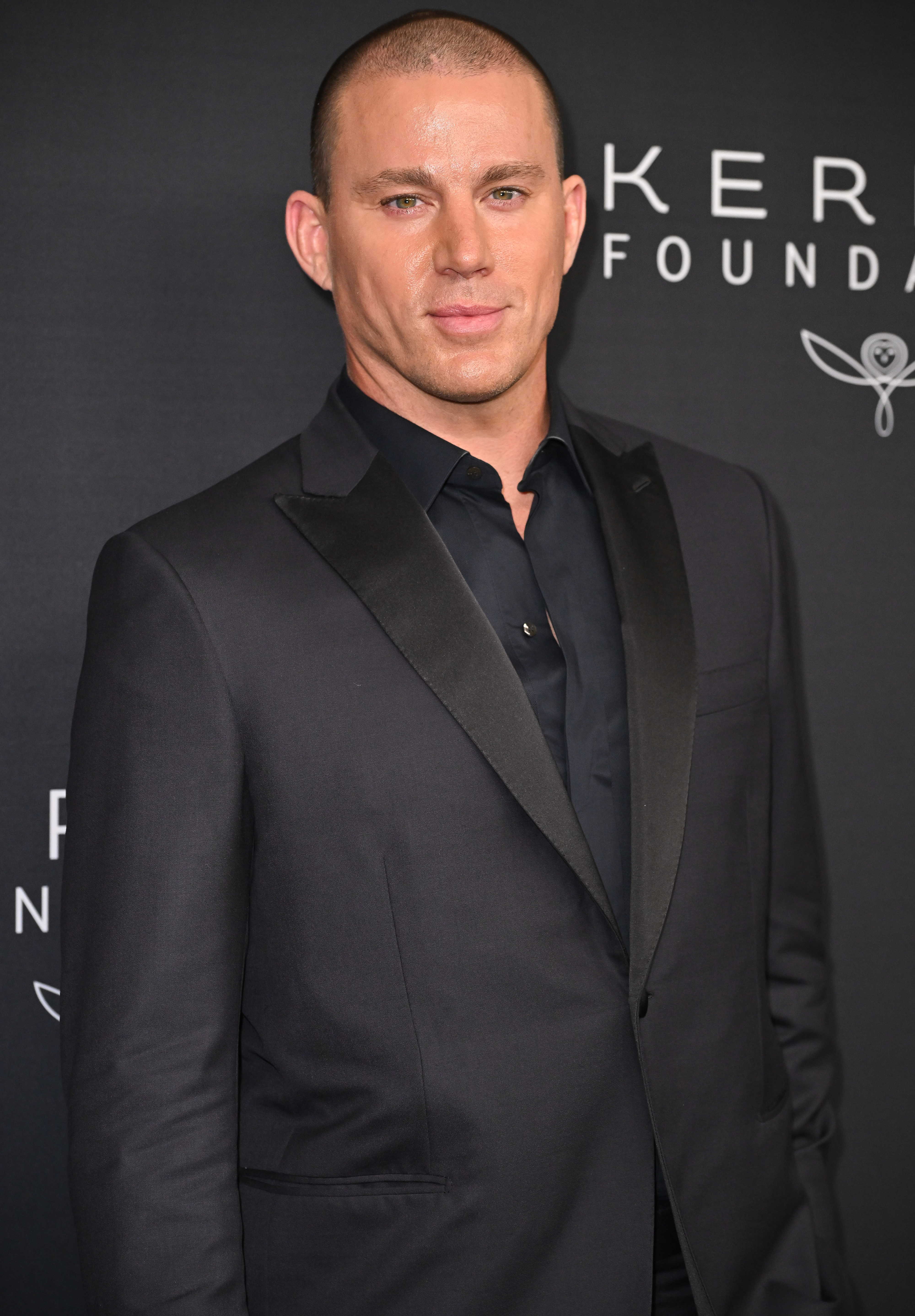 Close-up of Channing in a suit at a media event