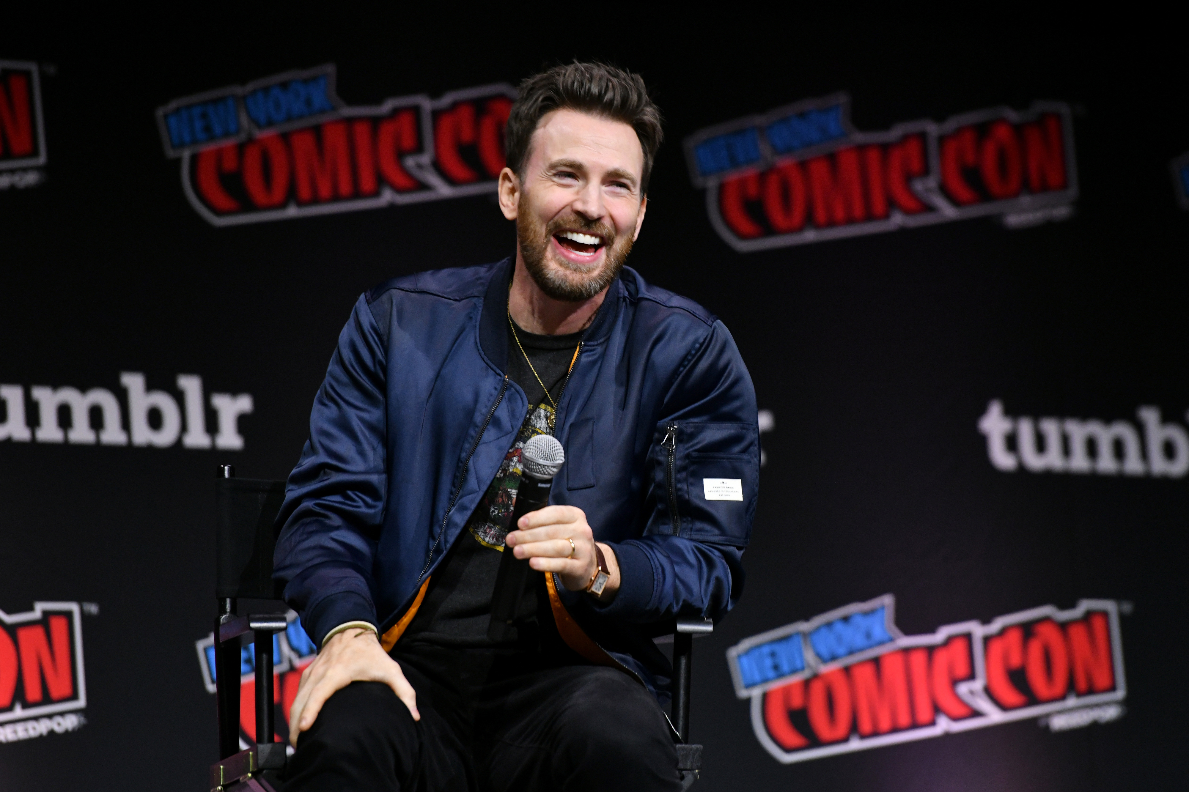 Close-up of Chris sitting onstage at New York Comic Con