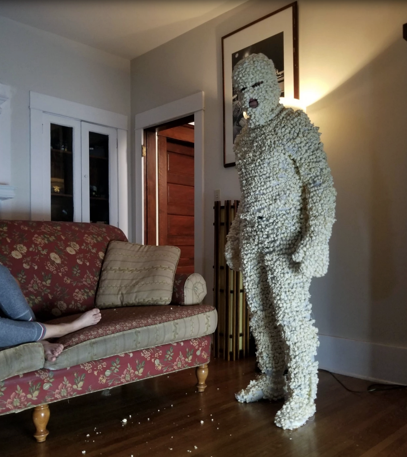man in a full body popcorn costume