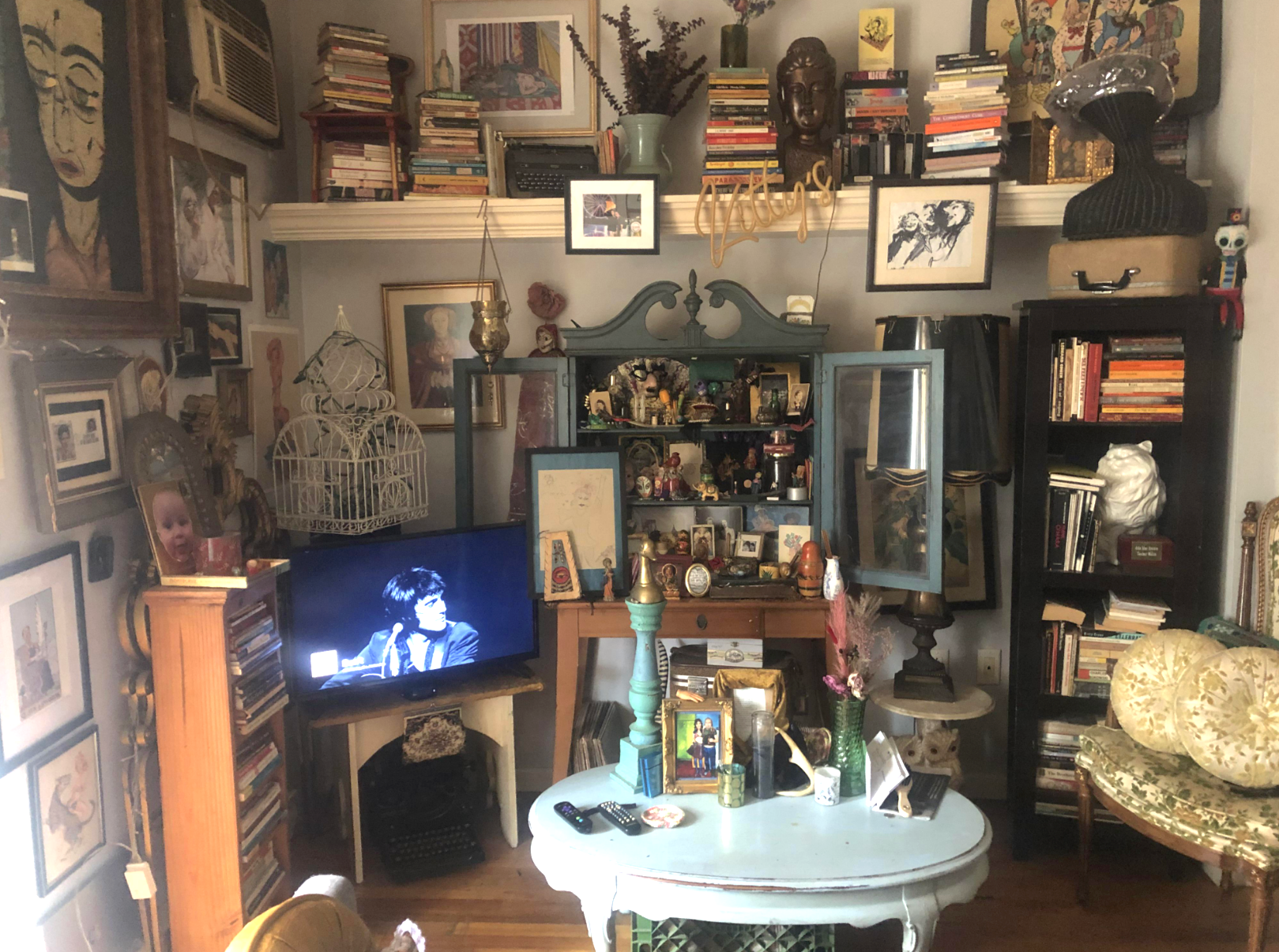 A living room with books all around